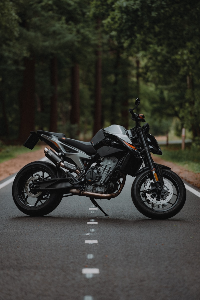 black and silver motorcycle on road during daytime